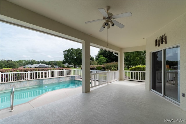 view of swimming pool featuring ceiling fan