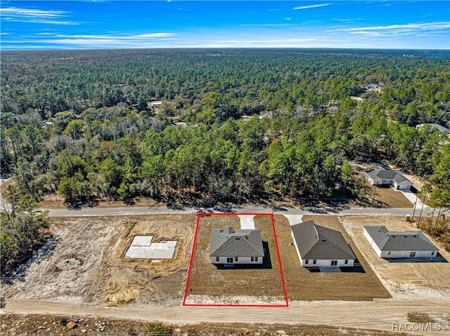 bird's eye view featuring a forest view