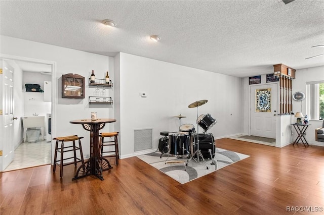 1420 E Silver Thorn Loop, Hernando, FL 34442 - dining room with wood finished floors, a textured ceiling, and baseboards