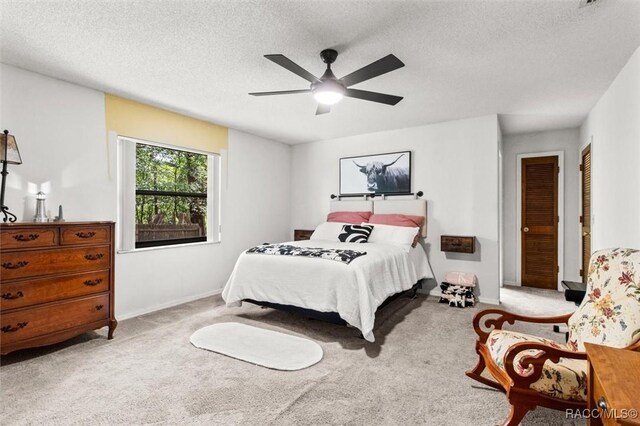 1420 E Silver Thorn Loop, Hernando, FL 34442 - carpeted bedroom featuring baseboards, a textured ceiling, and ceiling fan