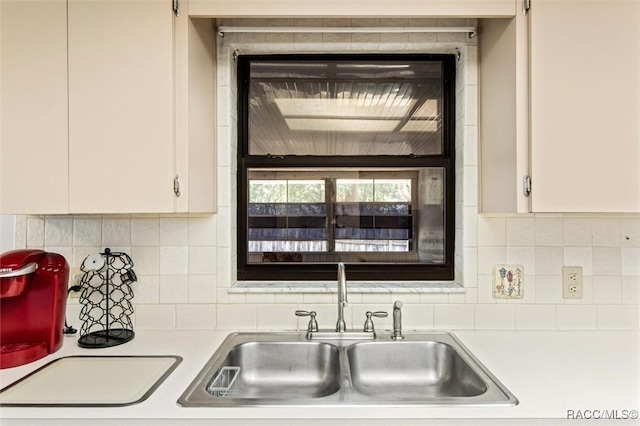 1420 E Silver Thorn Loop, Hernando, FL 34442 - kitchen with a sink, light countertops, white cabinets, and decorative backsplash