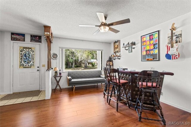 1420 E Silver Thorn Loop, Hernando, FL 34442 - dining area with wood finished floors, ceiling fan, a textured ceiling, and baseboards