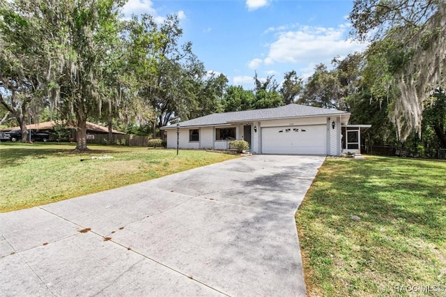 1420 E Silver Thorn Loop, Hernando, FL 34442 - ranch-style home featuring concrete driveway, an attached garage, and view of wooded area