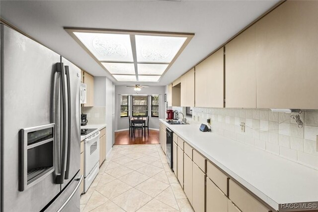 1420 E Silver Thorn Loop, Hernando, FL 34442 - kitchen featuring white appliances, light countertops, light tile patterned floors, tasteful backsplash, and a sink