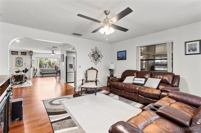 1420 E Silver Thorn Loop, Hernando, FL 34442 - living area featuring ceiling fan, arched walkways, and wood finished floors