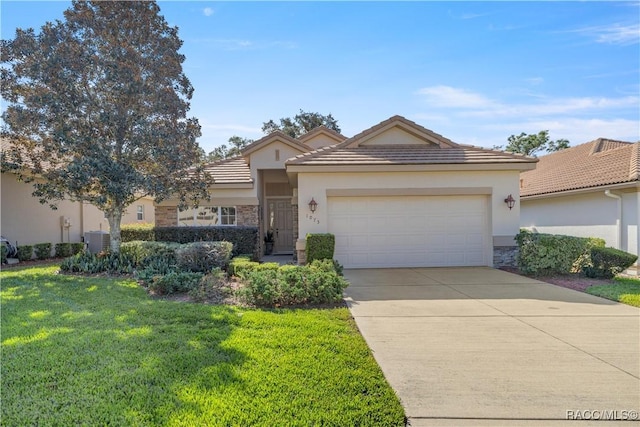 view of front of house featuring a garage and a front yard