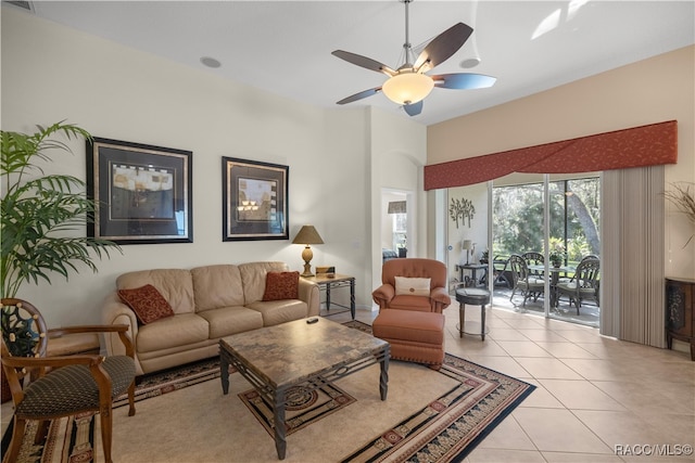 tiled living room with ceiling fan