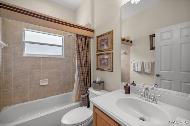 full bathroom with vanity, shower / bath combo, and toilet