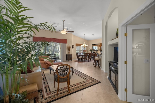 living room featuring light tile patterned floors, ceiling fan with notable chandelier, and lofted ceiling