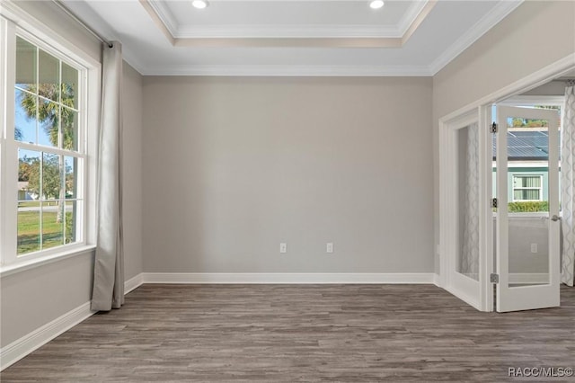 unfurnished room with dark hardwood / wood-style flooring, plenty of natural light, and ornamental molding