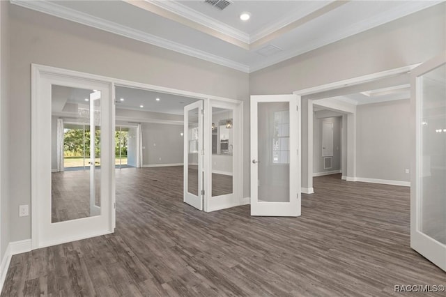 unfurnished room with ornamental molding, dark wood-type flooring, and french doors