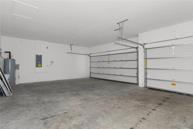 garage featuring electric panel and water heater