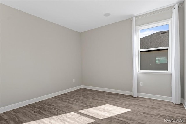 spare room with light hardwood / wood-style floors