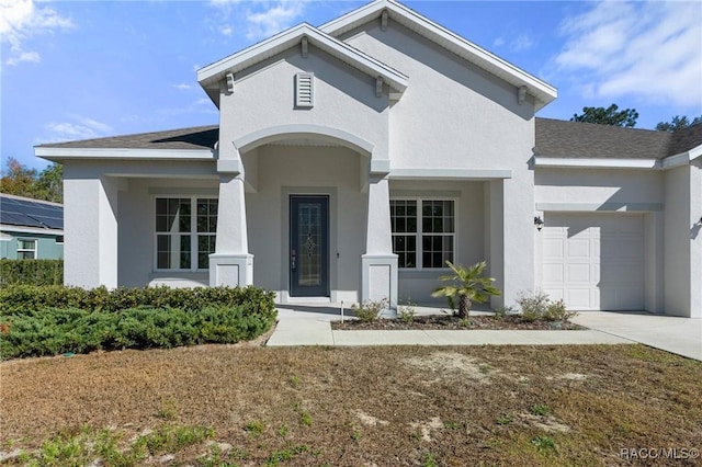 view of front of property featuring a garage