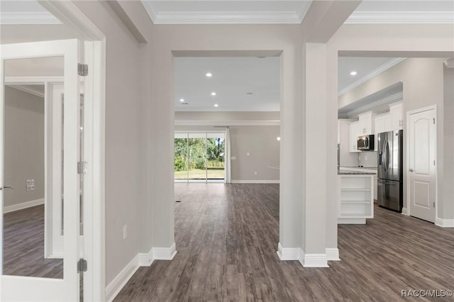 entrance foyer featuring dark hardwood / wood-style flooring and ornamental molding