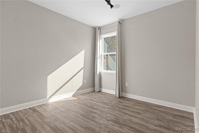 empty room featuring hardwood / wood-style floors