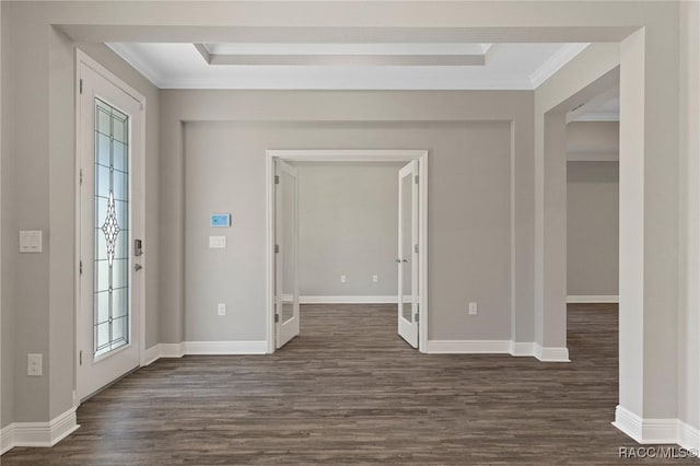 foyer entrance with dark hardwood / wood-style flooring, a healthy amount of sunlight, french doors, and ornamental molding