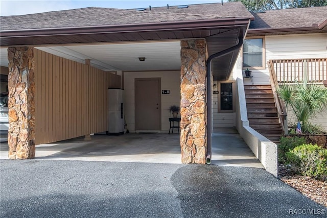 entrance to property with a carport