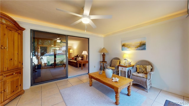 sitting room with ceiling fan and light tile patterned floors