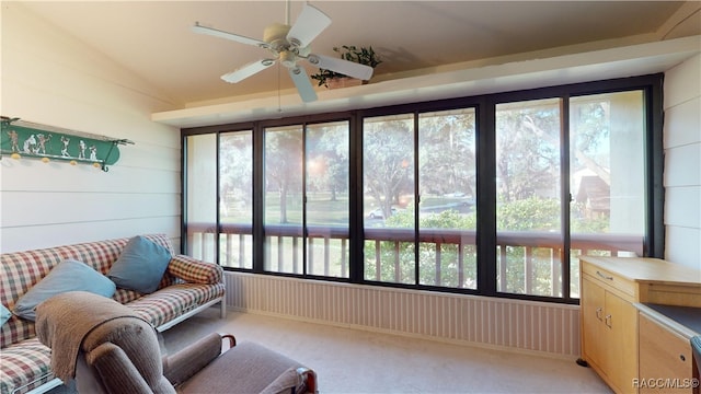 sunroom with plenty of natural light and ceiling fan