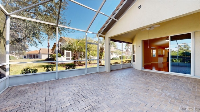 unfurnished sunroom featuring vaulted ceiling