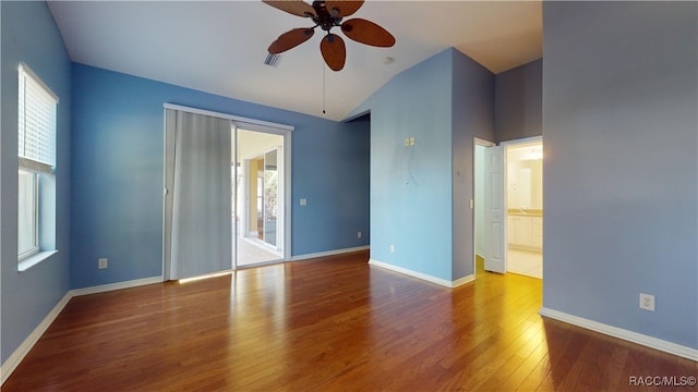 spare room featuring hardwood / wood-style flooring and ceiling fan