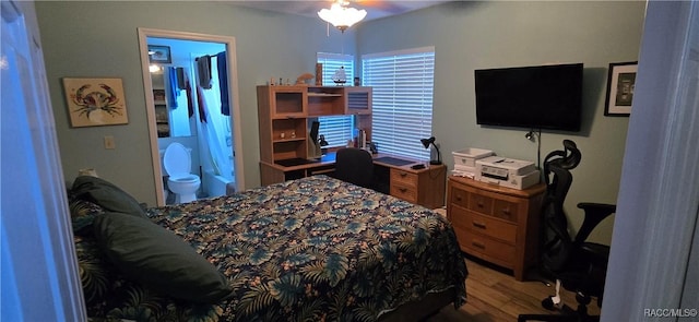 bedroom featuring wood finished floors