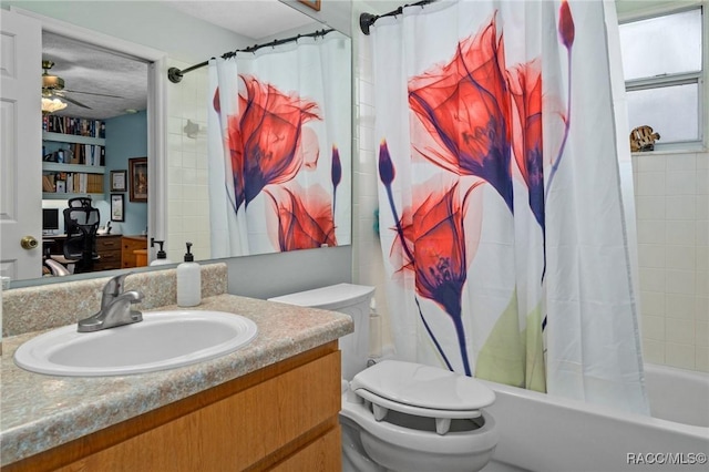 full bath featuring vanity, toilet, a ceiling fan, and shower / bath combo with shower curtain