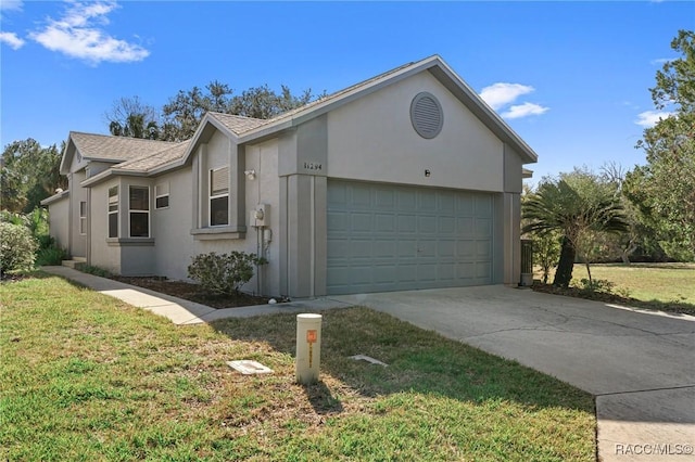 view of side of home featuring roof with shingles, a yard, stucco siding, concrete driveway, and a garage