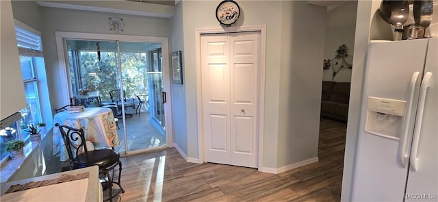 interior space featuring baseboards and wood finished floors