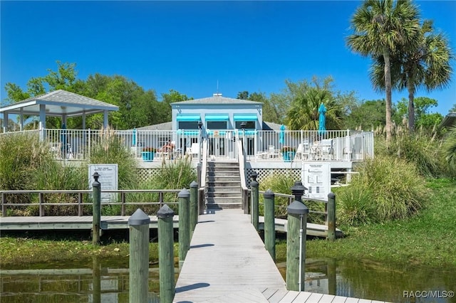 dock area with a gazebo and stairway