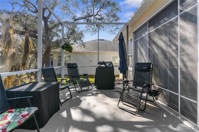 view of patio / terrace with a lanai