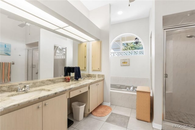 bathroom with vanity, tile patterned flooring, plus walk in shower, and ceiling fan