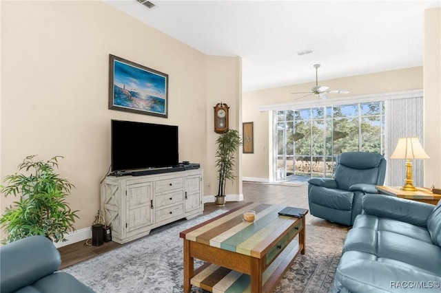 living room with hardwood / wood-style flooring and ceiling fan