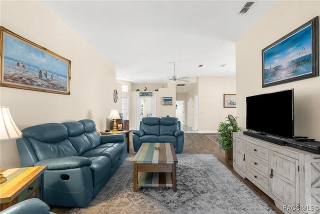 living room with wood-type flooring and ceiling fan