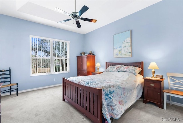 bedroom with light carpet and ceiling fan