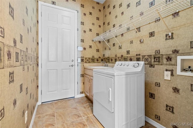 laundry room with washer / clothes dryer, sink, and cabinets