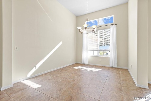 unfurnished dining area with light tile patterned floors and a chandelier