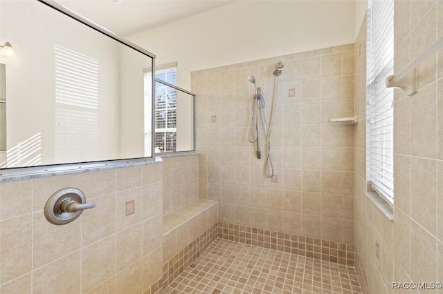 bathroom featuring a tile shower