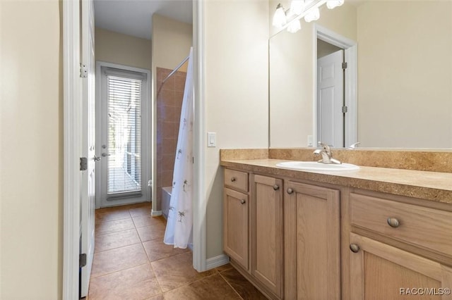 bathroom featuring tile patterned floors, shower / tub combo with curtain, and vanity