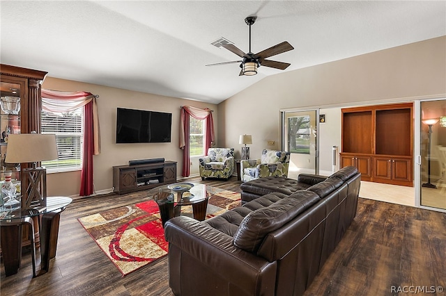 living room with ceiling fan, wood-type flooring, and lofted ceiling