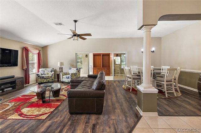 living room featuring hardwood / wood-style floors, ornate columns, ceiling fan, and lofted ceiling