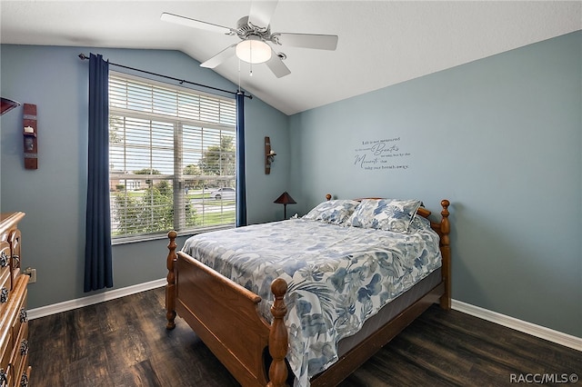 bedroom with lofted ceiling, ceiling fan, and dark wood-type flooring