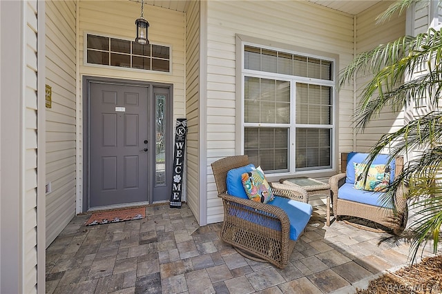 property entrance featuring a porch