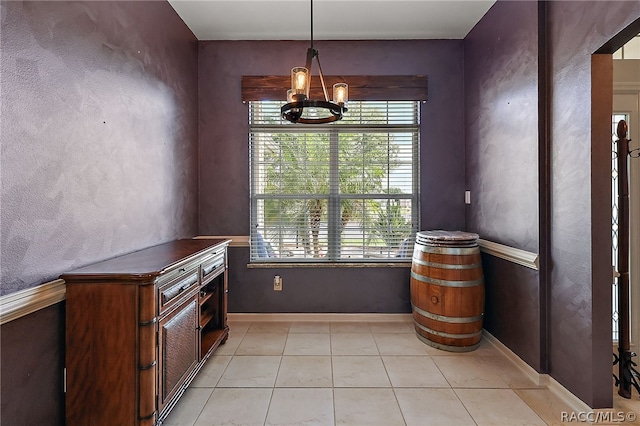 interior space with light tile patterned floors, an inviting chandelier, and hanging light fixtures