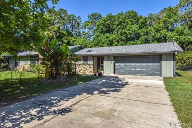 ranch-style house with a garage and a front yard