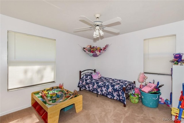 carpeted bedroom featuring ceiling fan