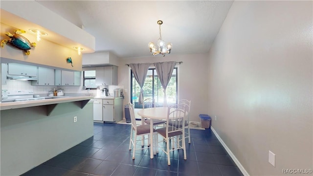 tiled dining area featuring a notable chandelier