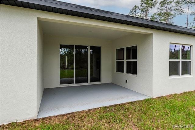 rear view of house featuring a patio