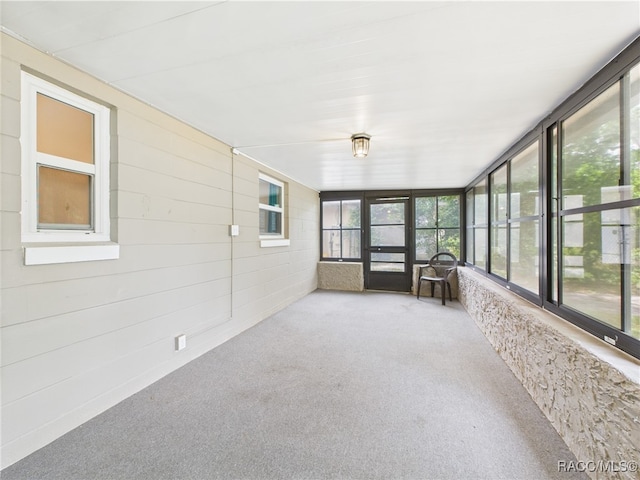 unfurnished sunroom with plenty of natural light
